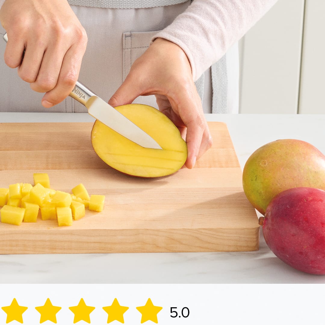 Ninja® knife easily slicing mango