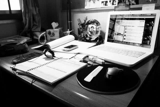 desk with laptop and notebook