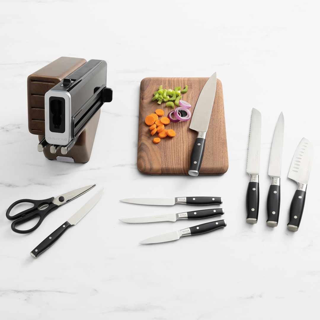 wood knife set with chopped carrots onion and celery